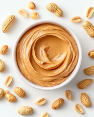 Peanut Butter roasted smooth. A creamy bowl of peanut butter surrounded by whole peanuts, showcasing a delicious and nutritious spread perfect for snacks and meals.