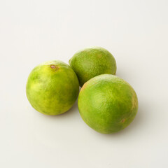 Fresh Limes Isolated in White Background for Culinary and Artistic Purposes