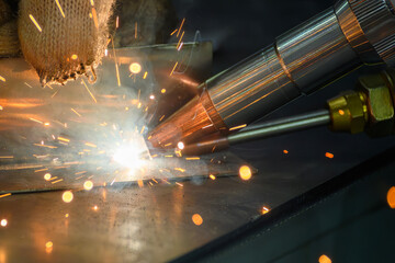 Close up scene the laser welding process by hand held laser welding machine.