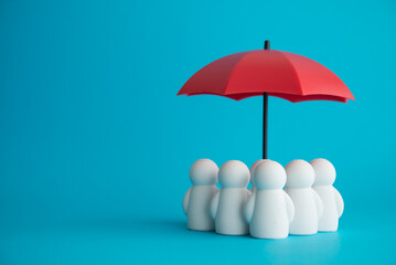 Health insurance or life insurance business and health care concept. People model under red...