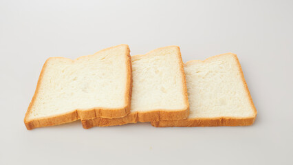 Isolated in White Background, Three Slices of Soft Bread Arranged Neatly for a Culinary Presentation
