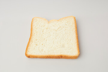 Isolated in White Background, a Single Slice of Bread Resting Flat With a Soft Texture, Showcasing...