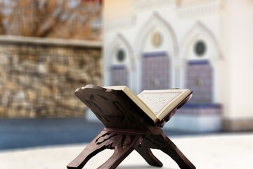 Islamic concept - Holy Quran book at beautiful mosque