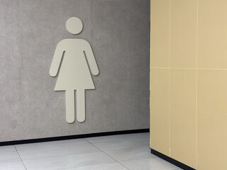 Big graphic sign of room for women, warm gray and yellow colours interior design