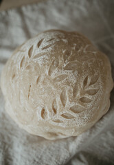 sourdough and flour on wooden board
