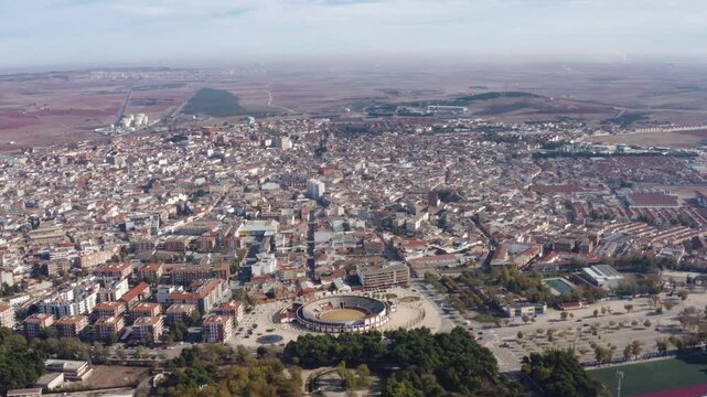Panoramic aerial view of Alcazar de San Juan City. Located in the province of Ciudad Real, autonomous community of Castilla&ndash;La Mancha. Travel destination. Drone going forward.