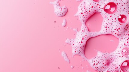 Obraz premium Soft pink background adorned with water drops creating a beautiful bubble foam texture for elegant design concepts