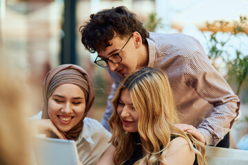 A Diverse MultiEthnic Group Reviewing Projects During a Work Break in a Caffee.