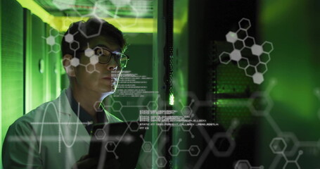Image of elements, charts and data processing over asian male technician working in server room