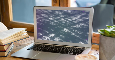 Image of binary coding on laptop in office