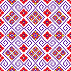 Obraz premium Intricate pixel art seamless geometric ethnic pattern with detailed motifs in red, blue, and yellow. ideal for textile and fabric prints, home decor, fashion, and craft projects.