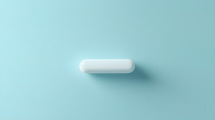 A single white capsule rests on a light blue surface
