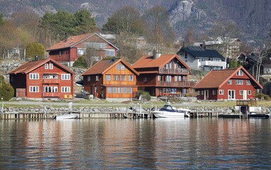 Fototapeta premium Traditional Red Wooden Houses By A Norwegian Fjord