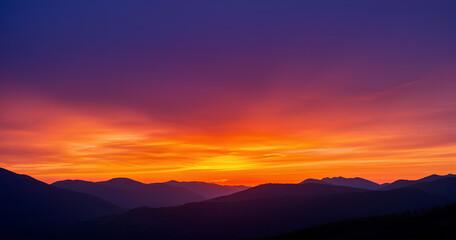 Fototapeta premium Dramatic Sunset over Mountain Range 