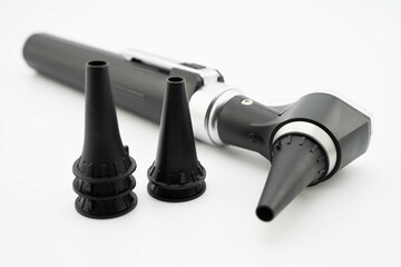 Otoscope isolated on white background for otolaryngologist or ENT physician doctor examining senior patient ear, hearing loss problem.