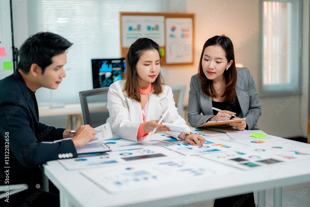 Poster asian businesspeople analyzing marketing data working with graphs and charts at office