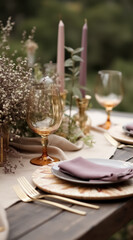 elegant outdoor table setting with amber glassware and mauve napkins