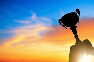 Success of teamwork, Winning team with trophy in hands.