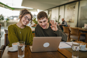 couple have a video call meeting or video course on laptop at coffee