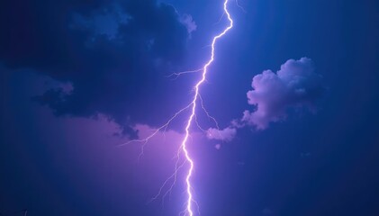 Defocused lightning bolt illuminates a dark blue and purple cloud, contrast, stormy