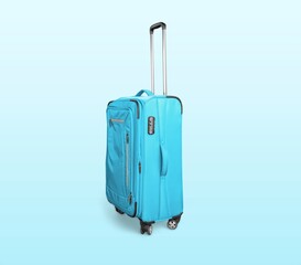 Colored classic suitcase on light background