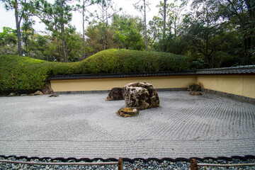 Exploring a Japanese rock garden at the  Morikami Museum and Japanese Gardens in Delray Beach, Florida.