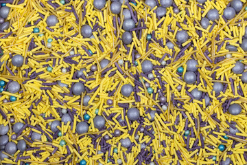 Yellow Jimmies and Silver Drag&eacute;es Sprinkles Background - Vibrant Baking Decoration Texture for Cake Photography with Metallic Pearls and Colorful Confectionery Mix