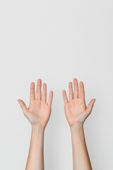 single pair of outstretched hands against plain white background symbolizing connection and compassion copy space above