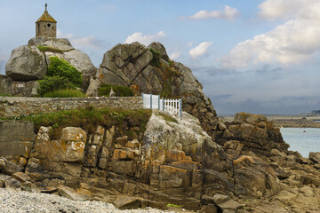 The Sentinel rock in Port-Blanc is very characteristic with its oratory surmounted by a cross in...