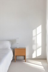 Bright and spacious bedroom with minimalist decor and natural light during the day