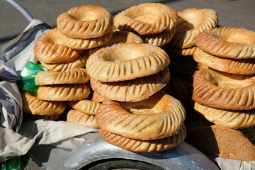 traditional uzbek flatbreads from tandoor on a cart close-up
