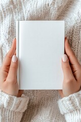 Captivating creation a blank notebook held by hands cozy indoor environment inspirational content personal reflection