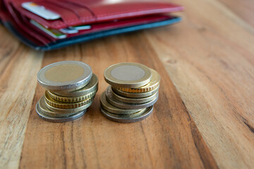 Metal coins stack. Money on the wood table.