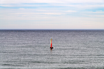idyllic seascape with a sail boat on the sea