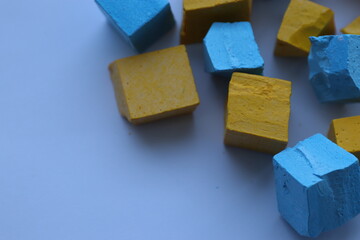 Paint for soy wax in the form of cubes, yellow 
paint, blue paint
