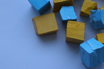 Paint for soy wax in the form of cubes, yellow 
paint, blue paint