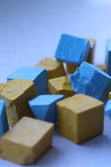 Paint for soy wax in the form of cubes, yellow 
paint, blue paint