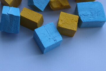 Paint for soy wax in the form of cubes, yellow 
paint, blue paint