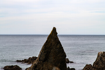 View of the rocky beach on a cloudy day