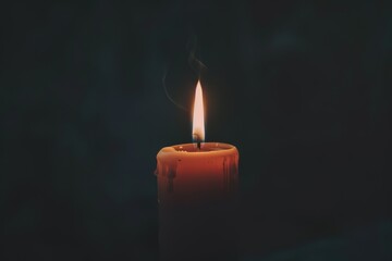 Solitary Candle Burning in the Darkness with Dramatic Lighting