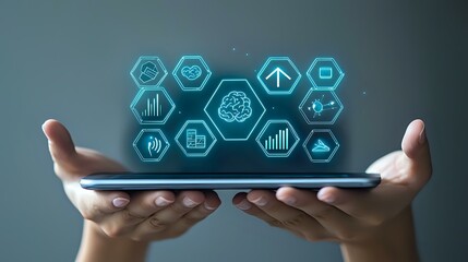 Hands holding digital tablet displaying glowing blue hexagonal icons with business and technology symbols, representing digital transformation and innovation.