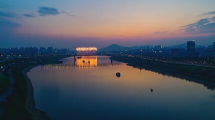 Fireworks illuminating the city over a calm river at sunset time
