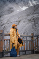 traveler with backpack on the mountain lake
