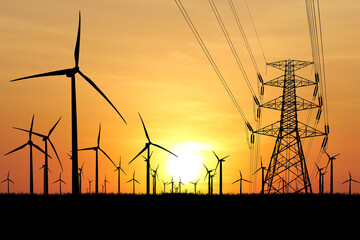 Renewable Energy Landscape with Wind Turbines and Power Lines at Sunset Silhouette Against Vibrant...
