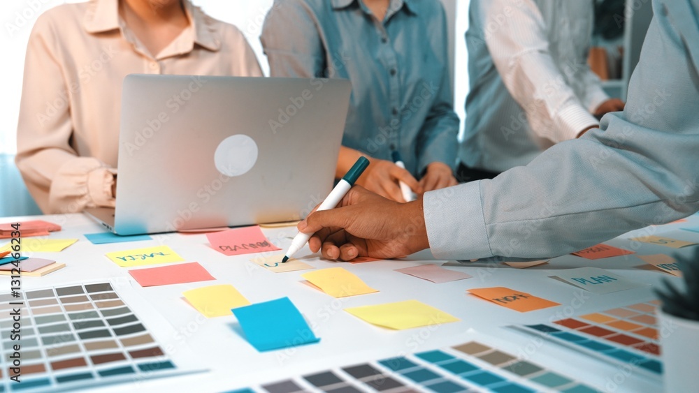 Poster a dynamic scene depicting a creative team collaborating on project development with colorful sticky 