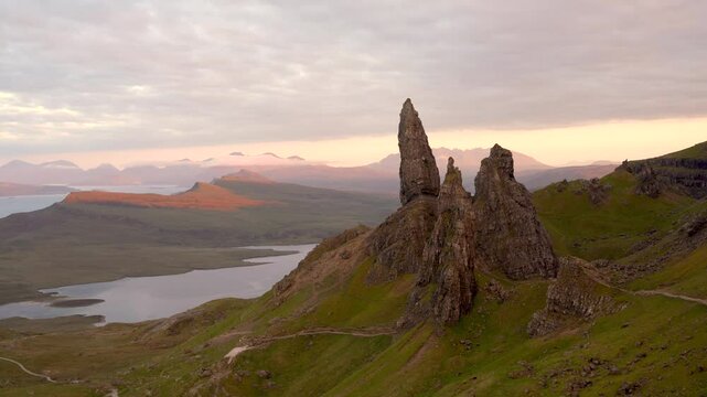 Old Man of Storr Scotland Wide Scenic Sunset Colorful Pink Cloudy Sky Landscape Vista Famous Rock Formation Travel Destination High Quality 4K