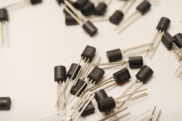 Old transistors on a white background. Electronic elements.