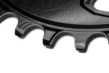 Close up of a black oval bicycle chainring against white isolated background. Professional bicycle...