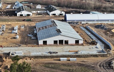 A building site where an agricultural farm is being erected. A construction site outside the city. Innovative construction in the agro-industry.