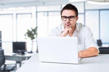 Fototapeta premium Busy business man work on computer in office